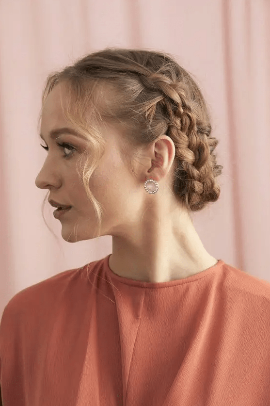 a short braided updo with some hair framing the face will be a perfect hairstyle for some special occasion