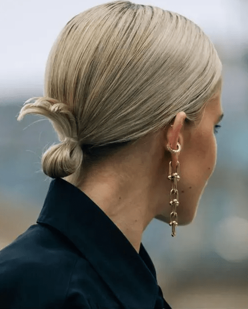 a sleek hairstyle with a low ponytail into a low bun is a very fast on the go hairstyle for short hair