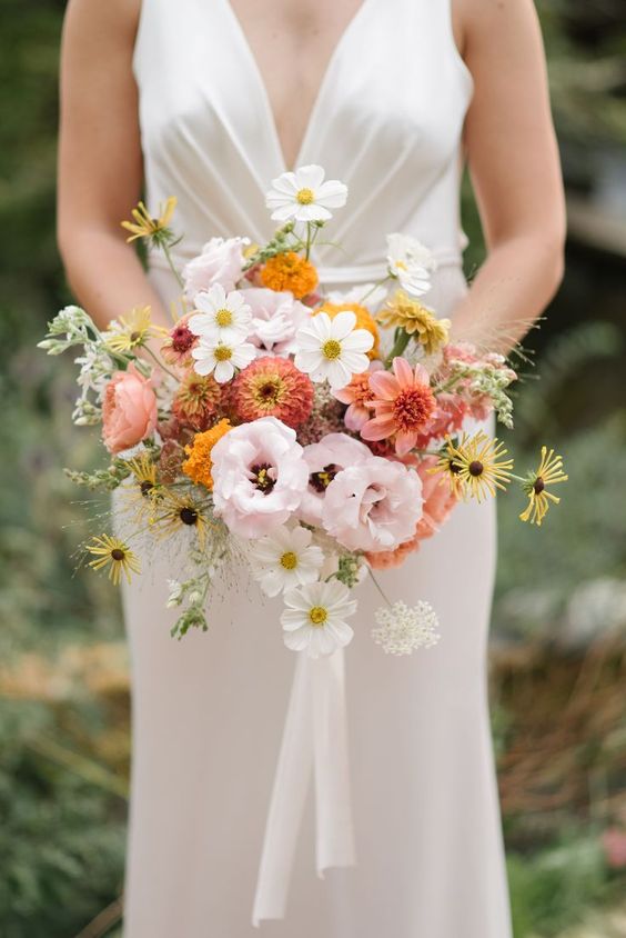 a spring or summer wedding bouquet of pink and blush blooms, white cosmos and some fillers is a lovely idea