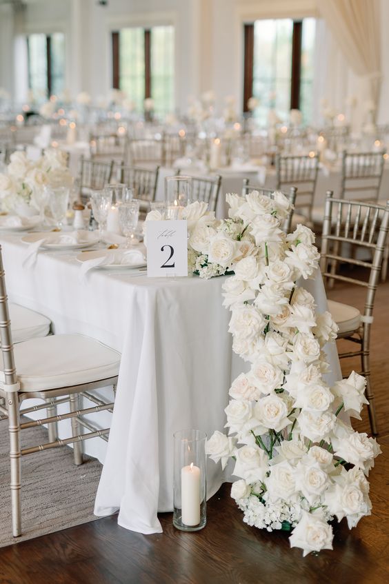 a stunning white rose cascading wedding centerpiece is always a good and very elegant decor idea for a wedding