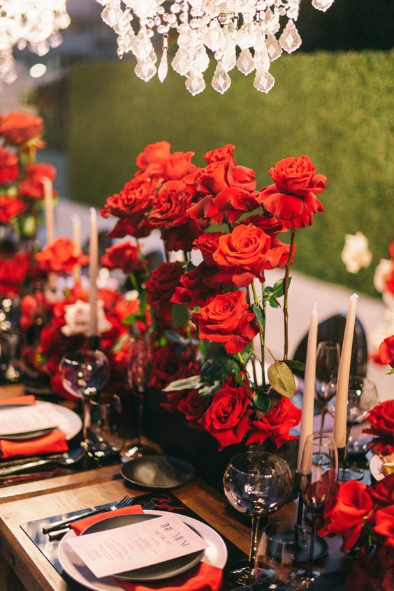 a tall long stem red rose wedding centerpiece is about classic romance, it looks refined, chic and bold