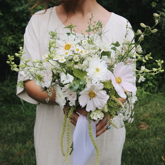 a textural wedding bouquet of white cosmos and fillers, green amaranthus is a very cool and relaxed idea for summer