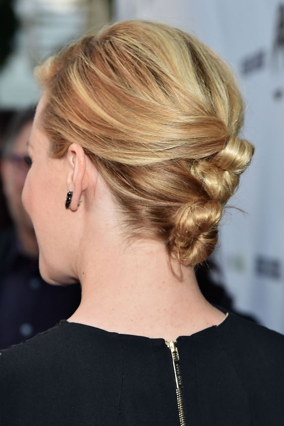 a tight wrapped bun updo with a bump on top is a cool idea for short and medium length hair