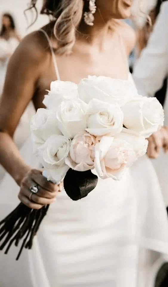 a white and blush rose wedding bouquet is a one flower combo that looks more eye-catchy as it includes two different shades