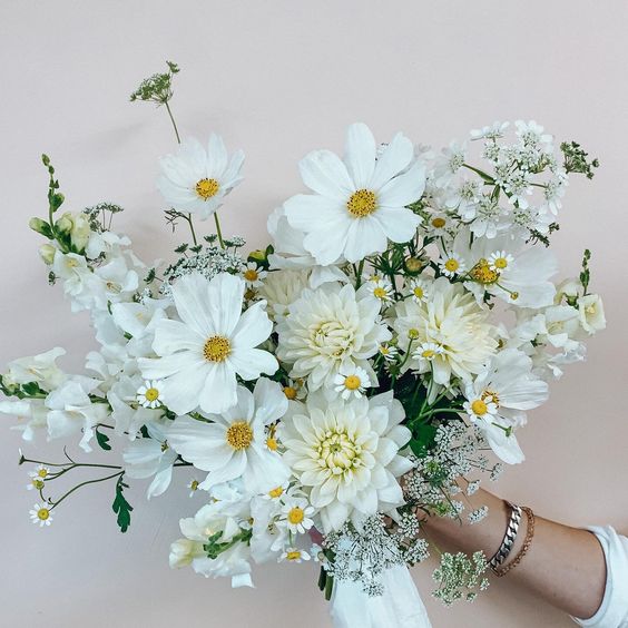 a white wedding bouquet of cosmos, dahlias and some chamomiles is always a good and relaxed solution