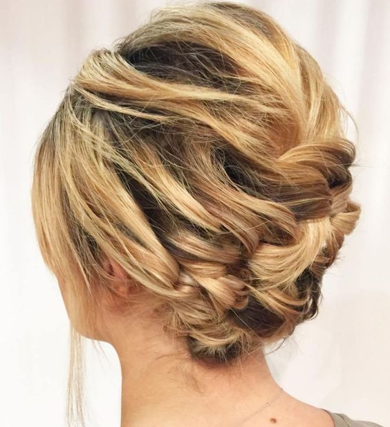 a woven updo with a bump on top and face-framing hair is a cool hairstyle for a wedding, it will work for short and medium hair