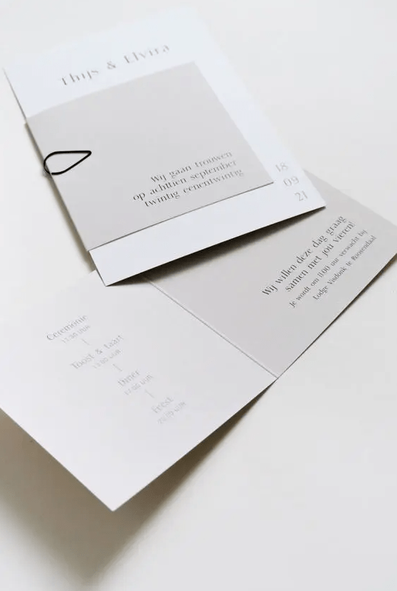 an elegant white and light grey minimalist wedding stationery suite with black letters and black yarn is a cool idea for your minimal wedding