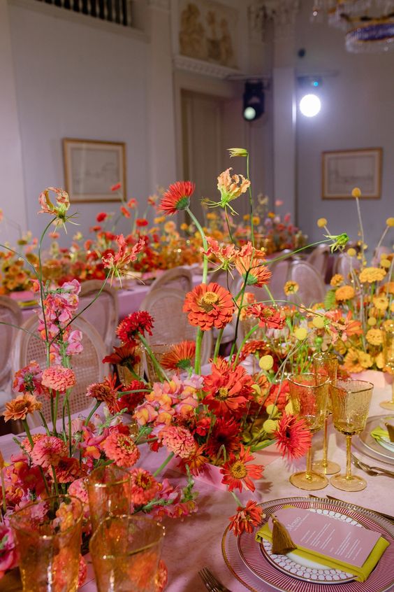 An ombre wedding centerpiece from red to orange and yellow is a gorgeous, bold and fairy tale like idea for a wedding