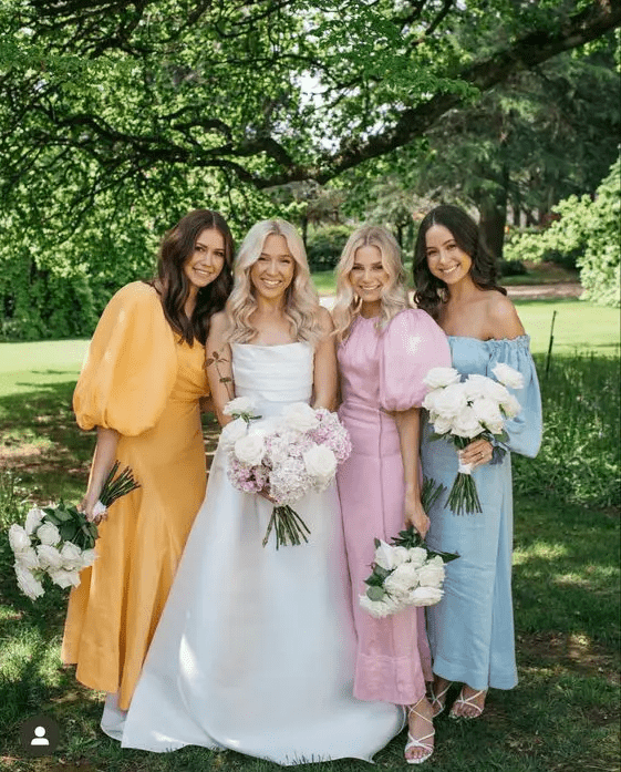 beautiful mismatching pastel maxi bridesmaid dresses plus white strappy shoes for a lovely spring wedding