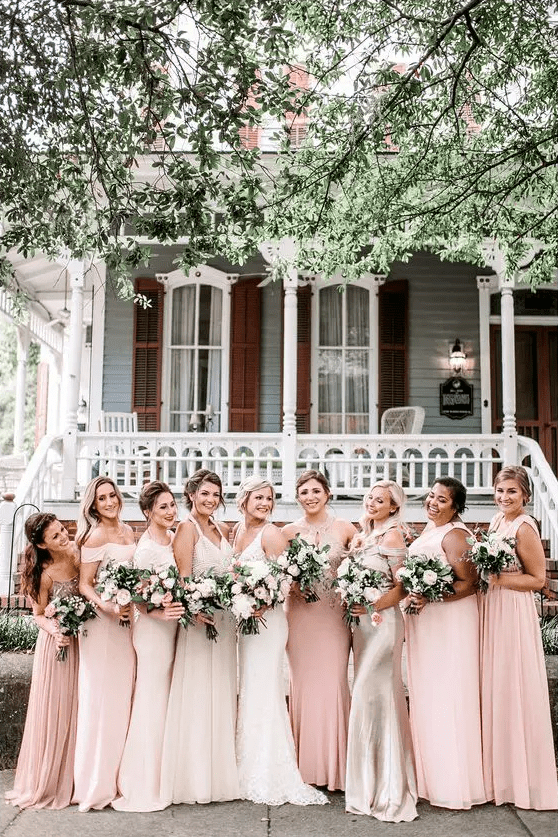 blush and pale pink maxi bridesmaid dresses with mismatching necklines are great for a spring wedding