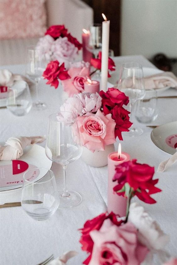 cluster wedding centerpieces of pink and hot pink roses and blush peonies are amazing for a modern wedding