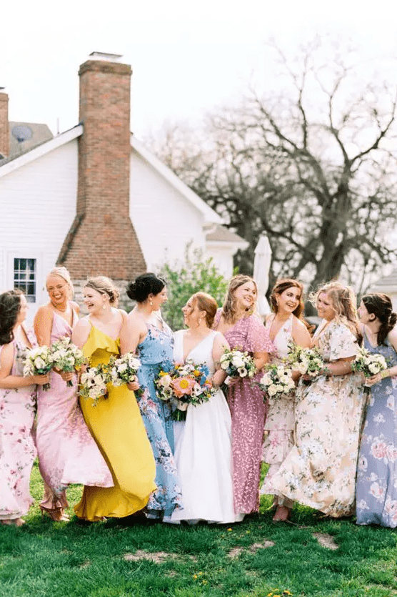 colorful and pastel floral maxi bridesmaid dresses with straps and sleeves, with shoes for a summer wedding