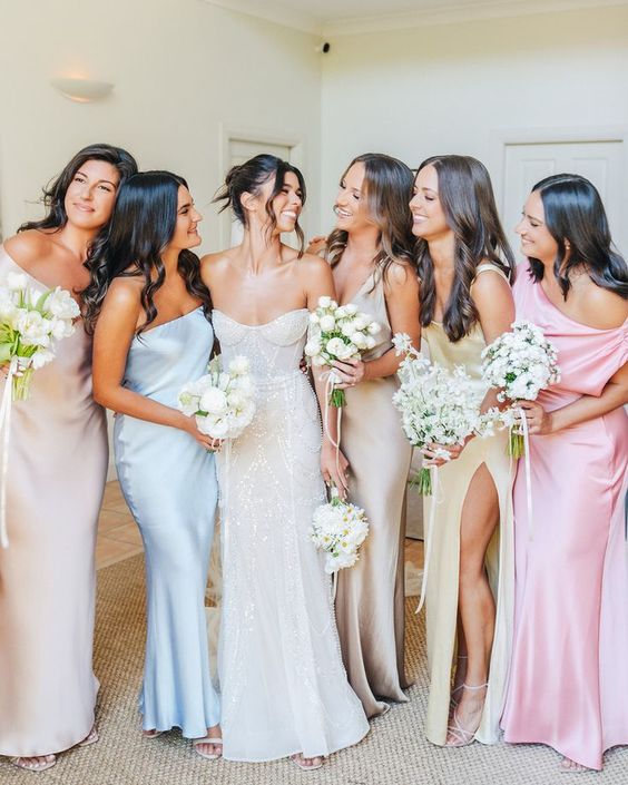 delicate pastel maxi satin bridesmaid dresses with mismatching designs are amazing for spring and summer