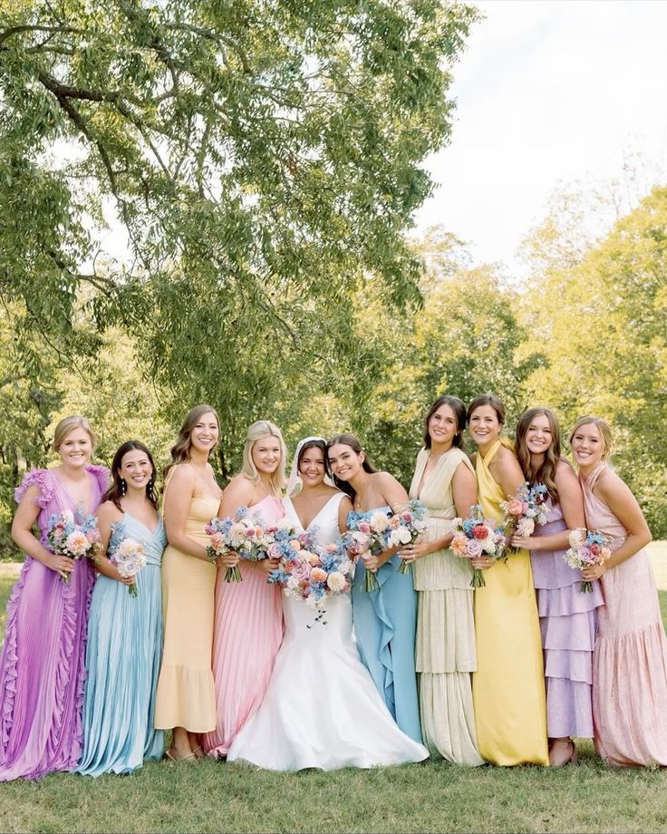 lovely mismatched pastel maxi bridesmaid dresses with yellow, lilac, blush, blue dresses for spring or summer