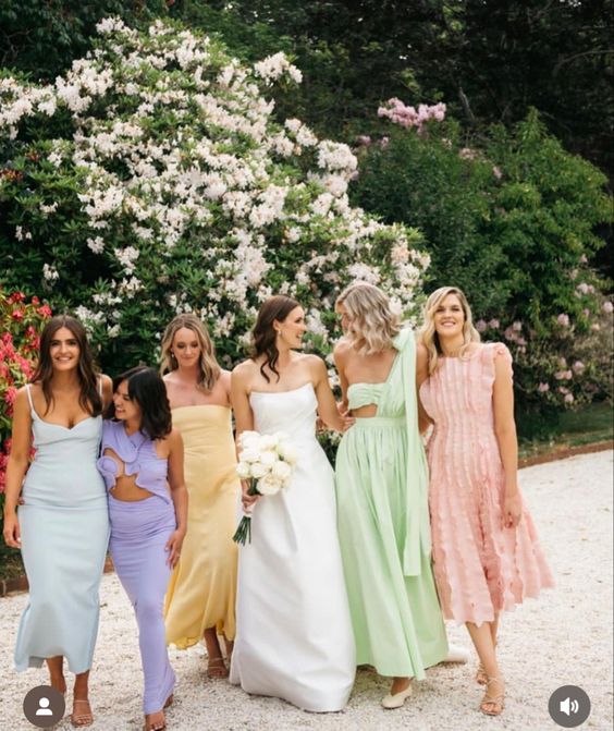 lovely modern mismatching midi and maxi bridesmaid dresses in all the pastel shades are amazing for spring and summer weddings