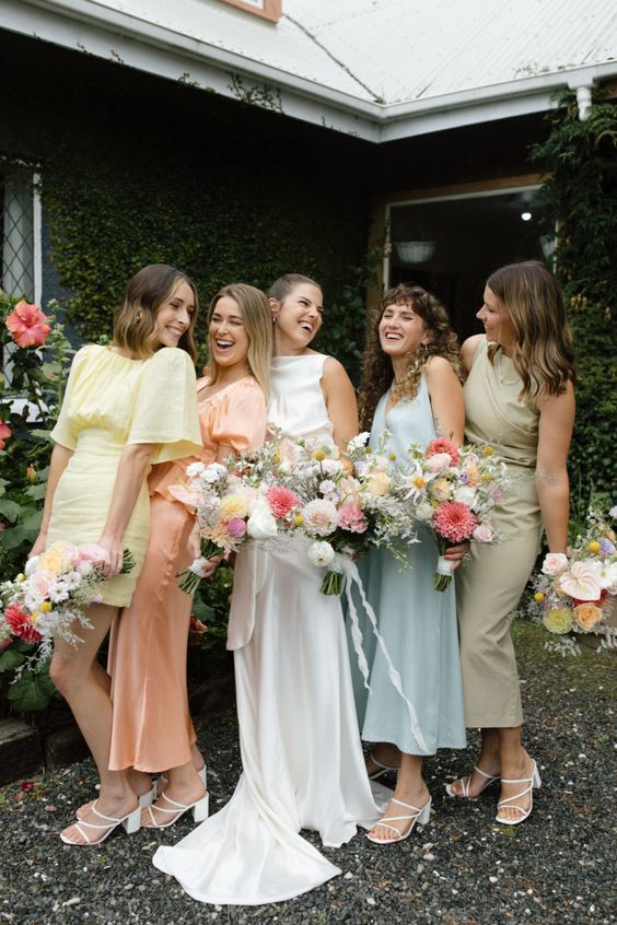 mismatching modern pastel bridesmaid dresses with white block heels are a gorgeous idea for  a spring wedding