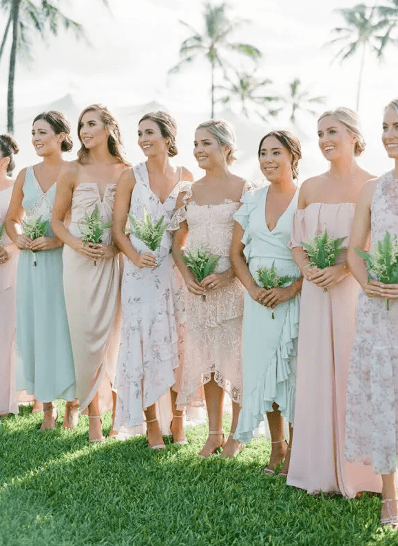 mismatching pastel midi bridesmaid dresses, plain, floral and lace ones, for a lovely spring wedding