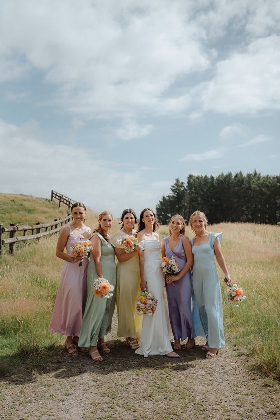mismatching pastel sating bridesmaid dresses with white shoes are always a good idea for spring and summer
