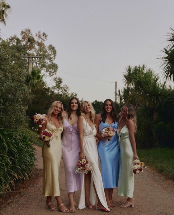 stylish matching satin pastel bridesmaid dresses paired with comfy heels are amazing for a spring or summer wedding