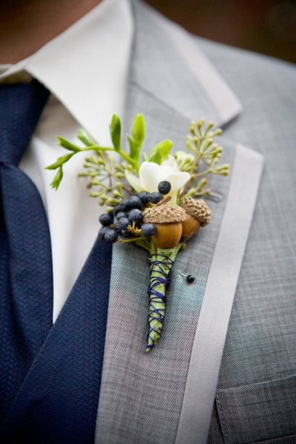 a cute acorn wedding boutonniere of acorns, white blooms, privet berries and greenery is a stylish idea for a fall groom or groomsman