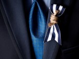 a nautical wedding boutonniere of a striped ribbon piece and rope is lovely and chic