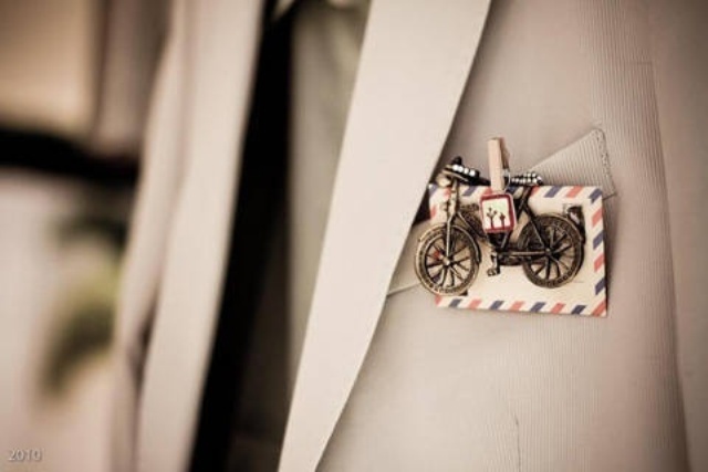 a mini boutonniere of an envelope, a vintage bike brooch and some ribbon is lovely and fun