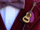 a mini guitar boutonniere is a lovely boutonniere for a music fan or a music-loving wedding