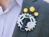 a creative gear wedding boutonniere with billy balls and a bottle lid with a monogram is a fun and cool idea to try