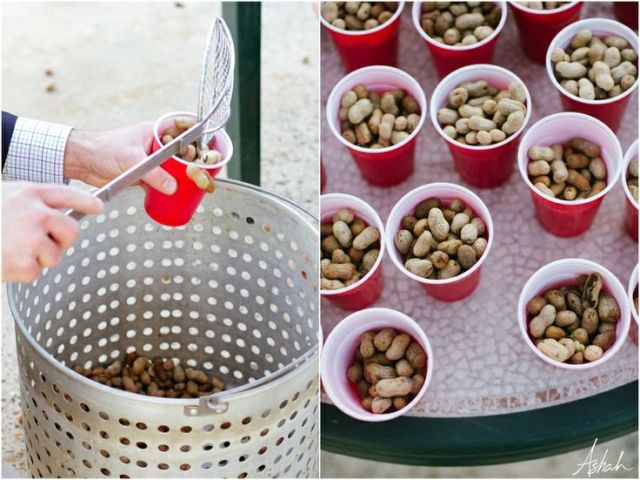 a perforated metal bucket with peanuts and small plastic cups for servign them are a creative idea to serve appetizers