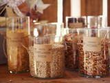 large glass jars with various nuts, with tags are amazing for serving them at your wedding