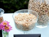 bowls and large bottles with peanuts are amazing for a wedding, this is a stylish way to serve them