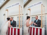 a simple and bright kissing booth with stripes and a sign on top is a cool idea for a modern wedding