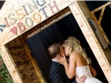 a plywood kissing booth with colorful letters is all you need for fun