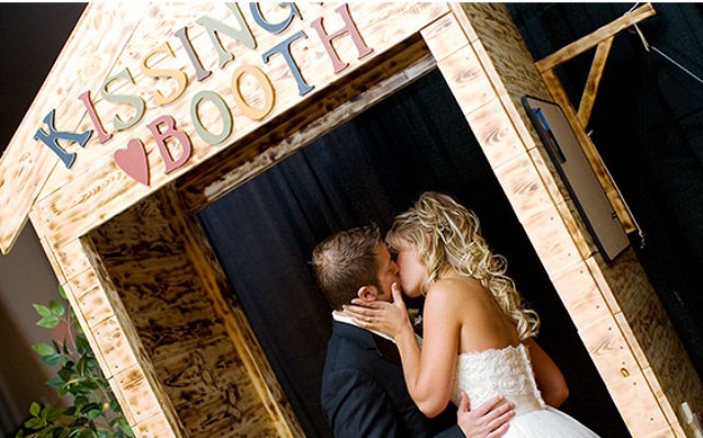 A plywood kissing booth with colorful letters is all you need for fun