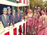a large and colorful striped kissing booth that doubles as a wedding bar is a cool and bold idea for a wedding