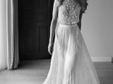 a fabulous two-piece wedding dress with a lace sleeveless crop top and a pleated maxi skirt with lace