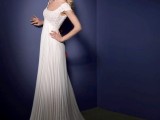 a refined A-line wedding dress with a lace bodice and cap sleeves and a pleated skirt with a train looks vintage-like