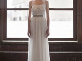 a lovely fitting maxi wedding dress with an embroidered bodice and spaghetti straps plus a pleated skirt with a belt
