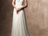a refined strapless wedding dress with a lace bodice and a pleated flowy skirt with a train is a gorgeous idea
