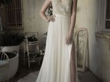 a stylish wedding dress with a gold lace bodice with spaghetti straps and a pleated A-line maxi skirt with a train and a slit