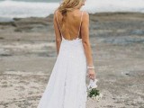 a lace A-line spaghetti strap wedding dress with an open back is a romantic and stylish gown