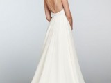 a white A-line spaghetti strap wedding dress with an open back is classics that always works