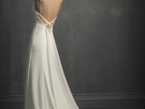 a plain A-line spaghetti strap wedding dress with wide straps on a criss cross back is a chic look for a bride