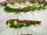 vine chandeliers with greenery and wildflowers are great decor for a boho wedding and they look spectacular
