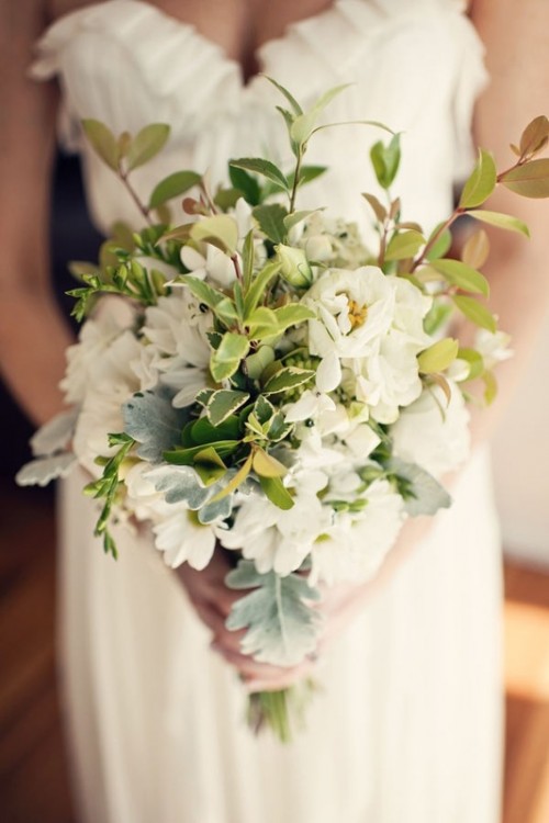 a white wedding bouquet with lots of green leaves is a pretty idea for a spring or summer wedding
