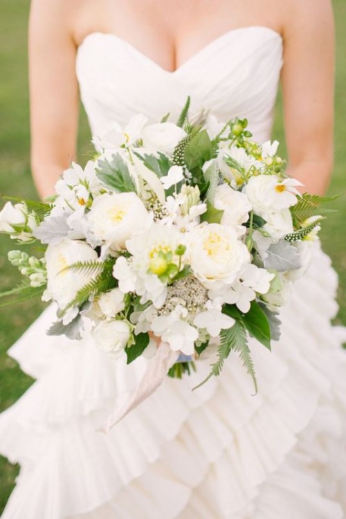 a white wedding bouquet with pale leaves, greenery and ferns, with astilbe is a cool idea for a spring or summer wedding