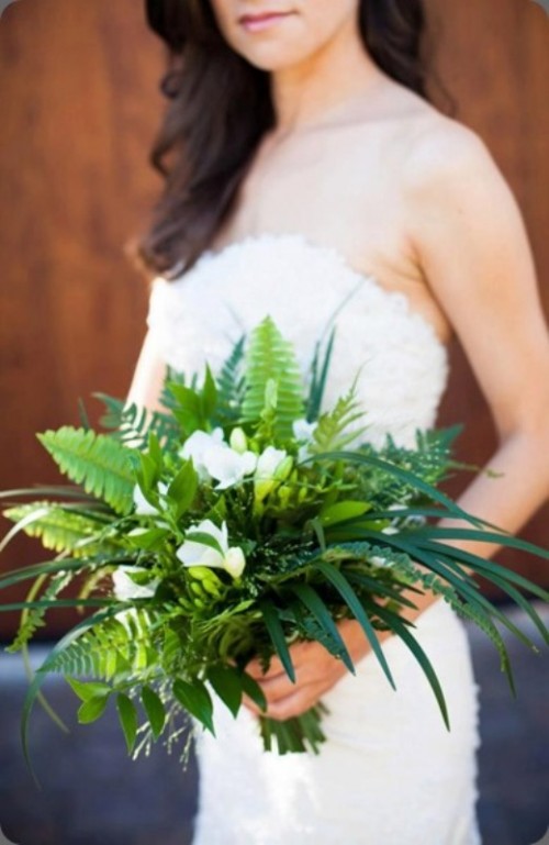 a textural and dimensional wedding bouquet with fern and grasses and white blooms is a cool idea for a forest wedding