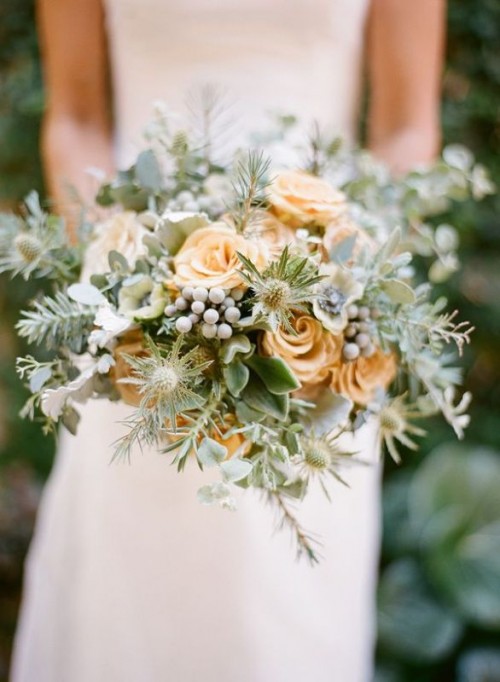 a textural wedding bouquet with pale leaves, thistles, berries, coffee-colored roses for a winter wedding