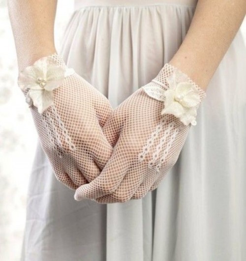 white crochet gloves with white fabric flowers and pearls for a romantic and beautiful bridal look