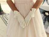 white draped gloves with large bows will add a retro touch to the look and more chic